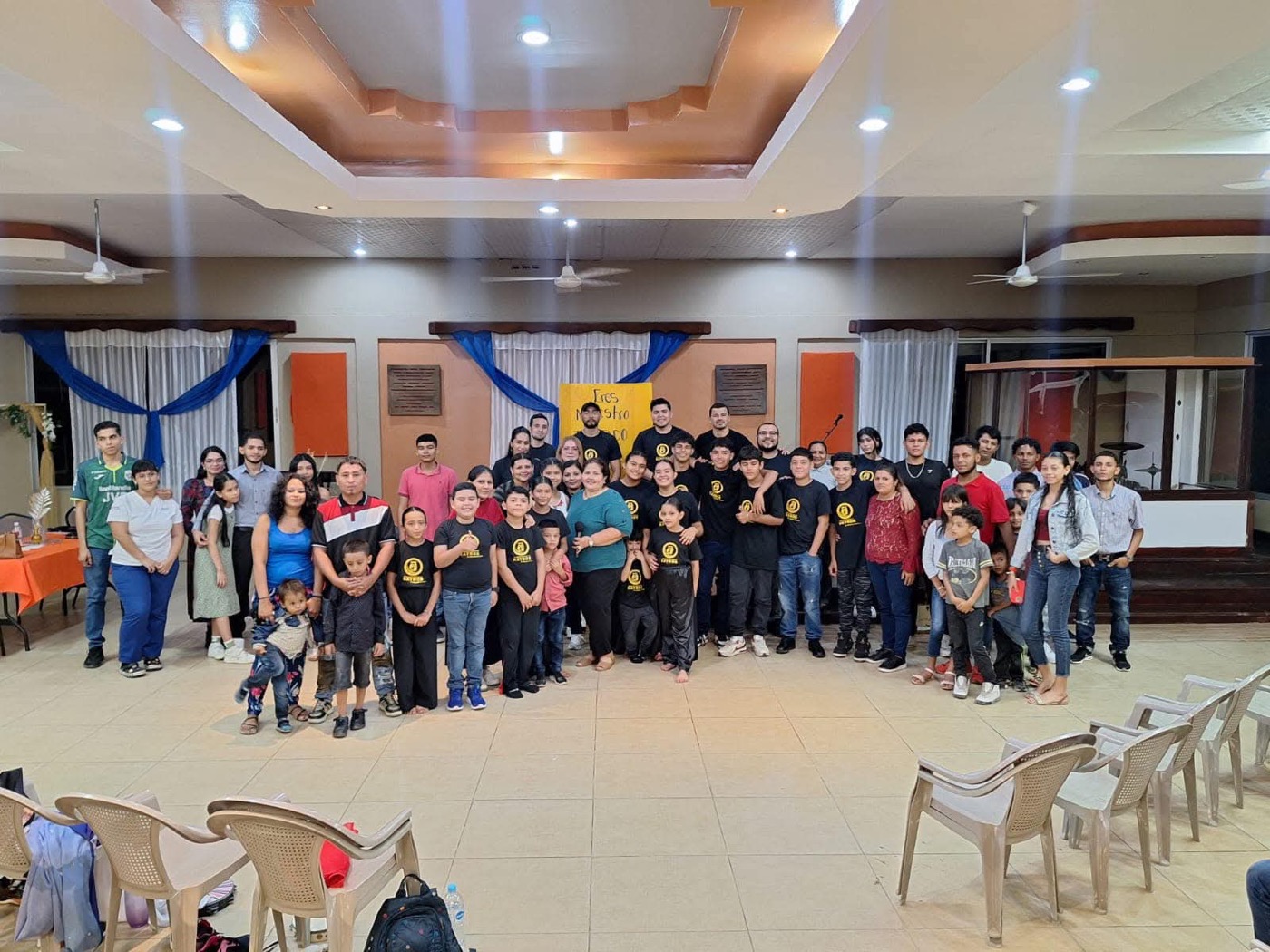 Group of children, young people and adults gathered together